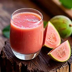 Glass of guava pulp extract and spirulina algae drink