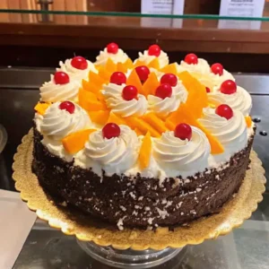 rosemary's bakery whipped cream cake on vintage stand